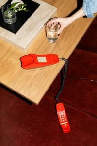 Modern Living Room Lifestyle and Interior Editorial with Retro Red Telephone, Coffee Table Styling and Flash Photography