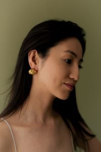 Kaboompics - Woman in Beige Tank Top Wearing Gold Earrings