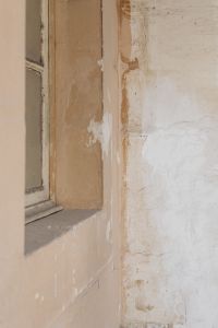 Kaboompics - Faded Paneled Frame beside Patched Plaster Wall