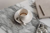 Kaboompics - Coffee, Planner and Silver Phone Close-Up on Arabescato Marble