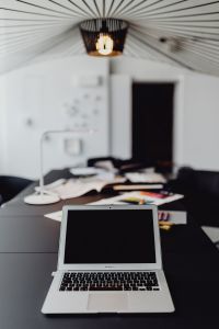 Kaboompics - Open MacBook on a Dark Worktable in a Designer Studio