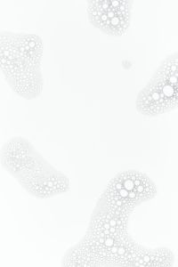 Kaboompics - White Cosmetic Foam Bubble Clusters Framing a Clear Center, Minimal Vertical Skincare Texture Background