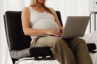 Kaboompics - Pregnant Woman Using a Laptop in a Lounge Chair
