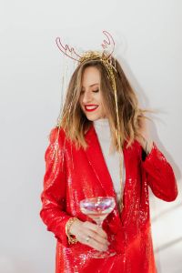 Kaboompics - Girlboss New Year's Eve Portrait in Red Sequins with Champagne