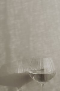 Kaboompics - Close-Up of Clear Water in a Ribbed Glass with Soft Shadows