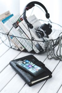 Everyday Objects and Work Accessories on White Wood