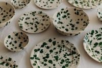 Kaboompics - Top-Down Green Splatter Bowls and Plates on Neutral Linen