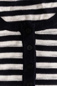 Kaboompics - Black and White Striped Knit Cardigan with Vertical Button Placket, Dark Buttons and Sweater Texture for Fashion