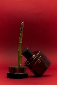 Kaboompics - Luxury Perfume and Asparagus: A Bold Visual Pairing