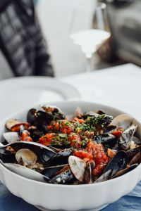 Kaboompics - Seafood Pasta with Mussels and Wine Glass Table Setting
