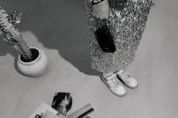 Kaboompics - Black and White Flash Photography of Woman Standing Beside Collage Materials