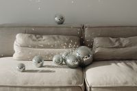 Kaboompics - Mirror Ball on Sofa Backrest with Smaller Cluster on the Seat