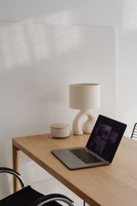 Kaboompics - Laptop Near Sculptural Lamp In Sunlit Office