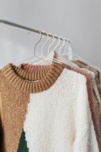 Kaboompics - Neutral Winter Clothing Display on White Rack