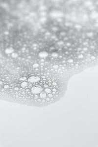 Kaboompics - Abstract Cosmetic Foam Bubbles with White Copy Space, Vertical Liquid Texture Background