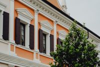 Kaboompics - Orange Designer Outlet Building with Shuttered Windows