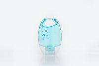 Kaboompics - Small Blue Sanitizer Bottle on White Surface with Copy Space