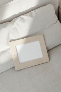 Kaboompics - Angled Speckled Frame Mockup on Beige Upholstery