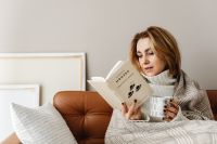 Kaboompics - Stay-at-Home Reading Under a Cozy Blanket
