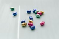 Kaboompics - Scattered Foil-Wrapped Easter Eggs Beside a Narrow Light Shadow