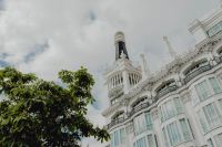 Kaboompics - Vertical Madrid Facade with Balconies, Blue Sky and Soap Bubbles in Foreground