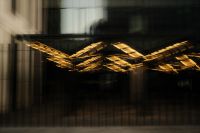 Kaboompics - Abstract Layered Golden Light Trails in Reflective Architecture