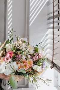 Kaboompics - Vertical Bouquet of Pink, Peach and White Flowers in Sunlit Window Light