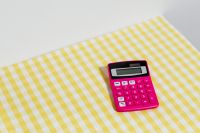 Kaboompics - Pink Calculator on Yellow Gingham With Copy Space