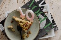 Kaboompics - Cake Slice and Pink Number Candle on a Plate