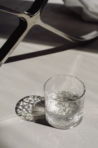 Kaboompics - Minimal Glass of Water on a Bright Neutral Surface