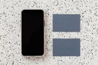 Kaboompics - Blue Business Card and Smartphone Mockup on Speckled Terrazzo, Copy Space