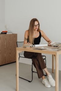 Kaboompics - Woman Reviewing Samples at Studio Desk