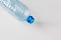 Kaboompics - Single Blue-Capped Bottle Cropped in Close-Up