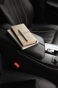 Kaboompics - Minimalist Notebook and Pen in a Car Interior