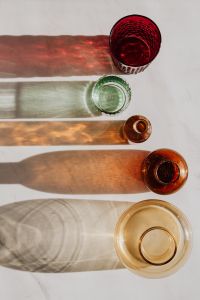 Kaboompics - Overhead Bottle Openings with Parallel Colored Shadows