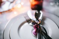 Kaboompics - Pink Christmas Baubles with Ribbon on a White Plate