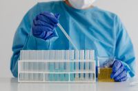 Kaboompics - Chemistry Teacher Pipetting Into Test Tube Rack