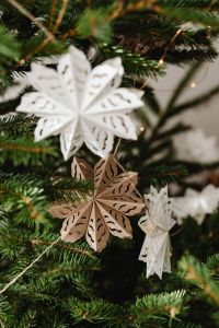 Kaboompics - White and Wooden Paper Snowflake Ornaments on Christmas Tree