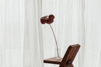 Kaboompics - Blooming Flower in Vase on Wooden Chair - A Charming Still Life Collection
