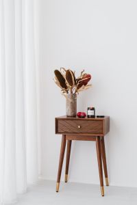 Kaboompics - Dried Protea Vase and Candle with Plums on a Walnut Side Table