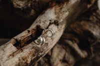 Kaboompics - Close-Up Silver Hoop Earrings on Pale Wood Grain