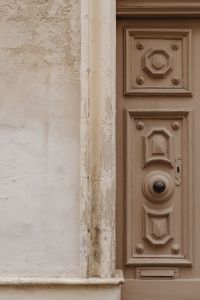 Kaboompics - Weathered Decorative Door Panel with Black Knob and Keyhole