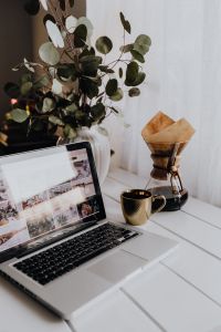 Apple MacBook & Coffee on the white desk