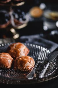 Kaboompics - Sweet Buns Served with Coffee on a Dark Table