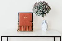 Kaboompics - Planner and Hydrangea Vase on Marble with Copy Space