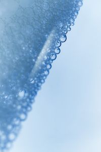Kaboompics - Diagonal Blue Soap Foam Edge with Soft Copy Space, Abstract Macro Background
