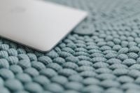 Kaboompics - MacBook Laptop on a blue pouf