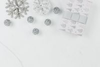 Kaboompics - Silver Baubles and Snowflake beside a Patterned Christmas Gift Box