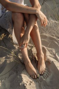 Kaboompics - Bare Feet and Statement Rings in Coastal Dunes