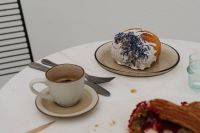 Kaboompics - Blue Sprinkle Croissant with Coffee and Fork
